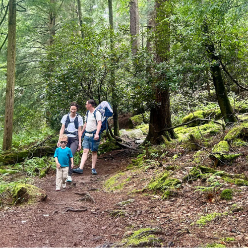 Family hiking on scenic trails in Cook Forest State Park in Clarion County Pennsylvania near Rustic Acres RV Resort campground.
