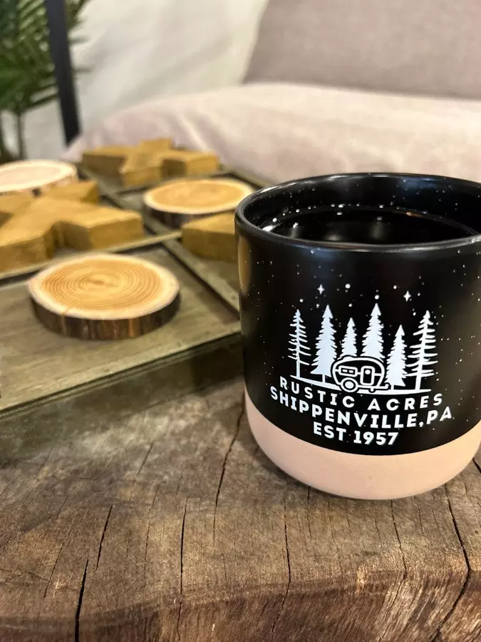 coffee mug sitting on table at the hub at rustic acres rv resort